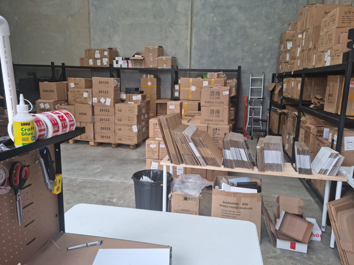 The packing bench and pallets of stock, July 2022